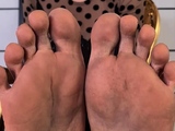 Petite redhead enjoys foot fetish session
