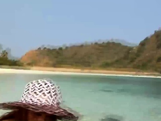 Petite ladyboy Mint teases with her big cock in beautiful